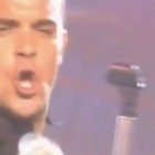 Let Me Entertain You lyrics by Robbie Williams live